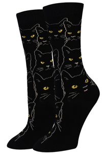 black socks with the outline of cats in grey and yellow eyes. black socks with the outline of cats in grey and yellow eyes.