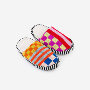 Side view of colorful knit slippers with a mix of stripes and checker print. Side view of colorful knit slippers with a mix of stripes and checker print.