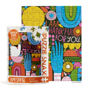 Puzzle displayed next to its packaging. Colorful illustration, text "I am thankful for you" Puzzle displayed next to its packaging. Colorful illustration, text "I am thankful for you"