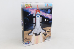 This image shows a multi colored box with a picture of a space shuttle made out of construction blocks.