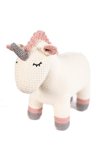 white and pink unicorn with grey horn against a white background