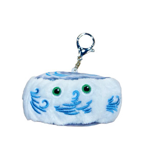 A plush keychain in the shape of a hurricane disc with a face on the side