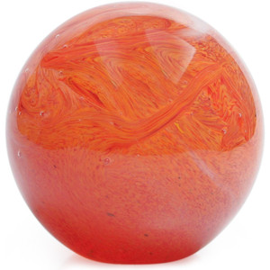A spherical paperweight a made with shades of black and red glass to resemble the planet Venus