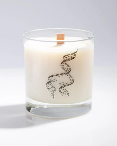 An unlit cocktail candle with the imprinted image of a DNA strand