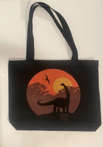 black tote with Dippy logo set against an orange and red sunset
