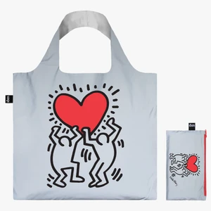 Reflective tote bag with Dancing Heart art work by Keith Haring, displayed next to it's storage bag.