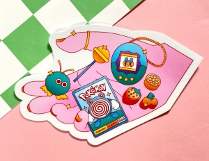 90's Kid Matte Vinyl Sticker with trinkets in pink hand