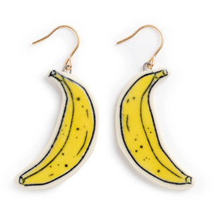 Ceramic earrings that look like bananas. Color yellow.