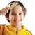 A child using the T-Rex comb to brush thru his hair. A child using the T-Rex comb to brush thru his hair.