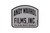 Image of a tombstone shaped grey sticker that reads "Andy Warhol Films Inc."