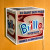 A lit Brillo box artwork hanging on a wall
