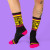 A pair of socks being worn by  a person, front view.