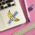 The banana sticker placed on a corner of a laptop. The banana sticker placed on a corner of a laptop.