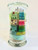 A 3 layered candle reflecting the dinosaur timeline with rocks, gems and dinosaurs hidden inside.