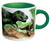 White mug with green handle fleshed out dinosaur.