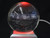 A 3" crystal sphere lamp with the solar system engraved in the interior and lit in red on a silver-colored USB powered base.
