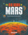 A book cover with art of a person standing on the planet Mars looking up at the Martian moons Phobos and Deimos.
