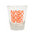 A clear glass shot glass with the NASA worm logo in three orange rows.