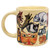 Yellow mug, handle shown, with various cats from famous artworks.
