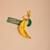Banana shaped flat charm attached to key ring and a smaller pickle shaped charm.
