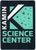 A sticker of the Kamin Science Center Logo with a dark blue background and white and light blue text