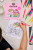Lifestyle photo of a person coloring in a torn page from the kawaii coloring book.