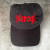 Black cap with red embroidery that says Pierogi