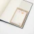 the sticky notes tucked into a notebook cover