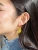 Banana Earrings in ear