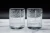 A pair of whiskey glasses etched with a Pittsburgh Street map
