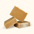 An image of three bars of soap stacked atop each other. The soap is amber colored and rectangular.