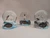 An image of all three snow globes. They feature a polar bear, penguin and chick, and wolf. Their bases are arctic blue with three-dimensional additions of their respective animals.