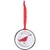 This circular double-sided metal ornament features the 1954 "Cardinal with Berries" illustration of a  bright red cardinal perched among angular, stark branches while consuming vibrant clusters of berries in the "minimal realism" and geometric style Charley Harper was known for. A silver ring hangs separately, with a red ribbon attached to this for hanging.