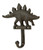 This singular unit features the raised metal motif of a walking stegosaurus over a key hook.