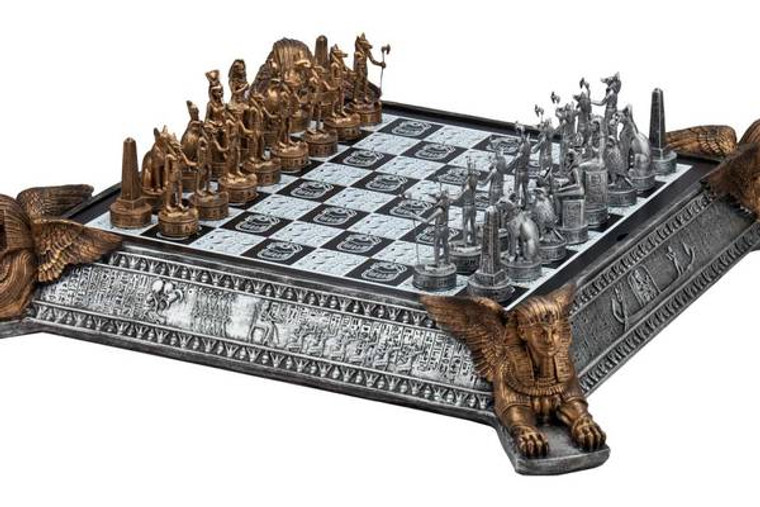 Gold and silver Egyptian chess set with decorative chessboard.
Chessboard with Sphinx on four sides also serve as storage for the chessmen.