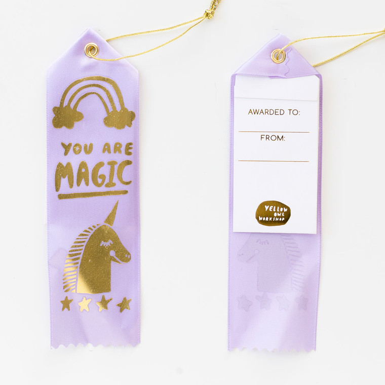 image of  purple award ribbon with a gold foil unicorn.