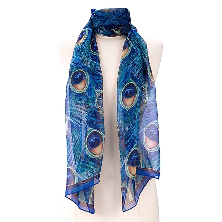 This shear scarf is bordered in blue, with a fan of  brilliant peacock feathers in blue, green and gold.