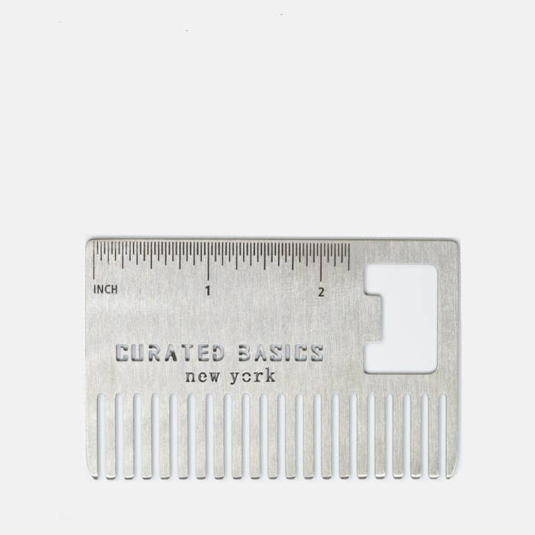 Steel comb with 2 inches of ruler markings.