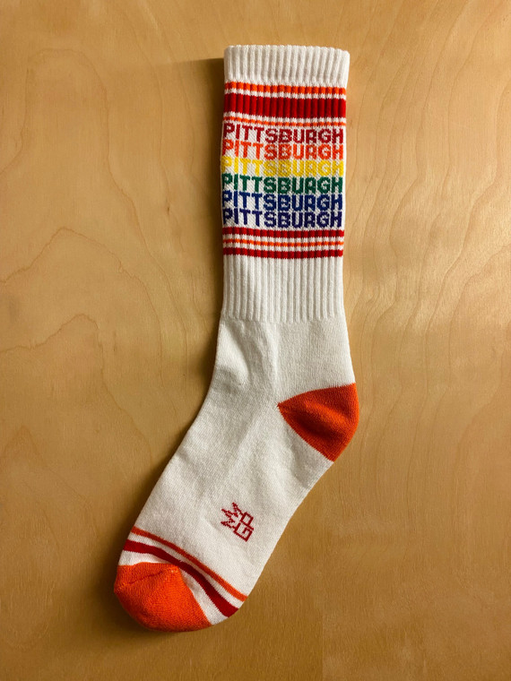 A gym sock with rows of rainbow lettering "Pittsburgh"
