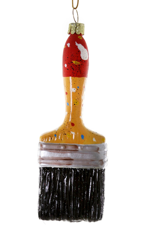 A paint splattered broad paintbrush