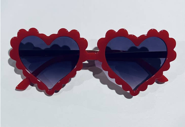 Red sunglasses with scalloped heart-shaped frames.