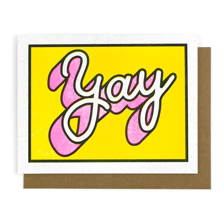 Notecard with white cursive text on a yellow background, text: yay