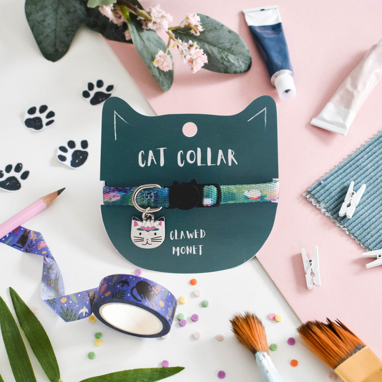 Waterlilies printed collar around dark green cat-shaped cardstock packaging.