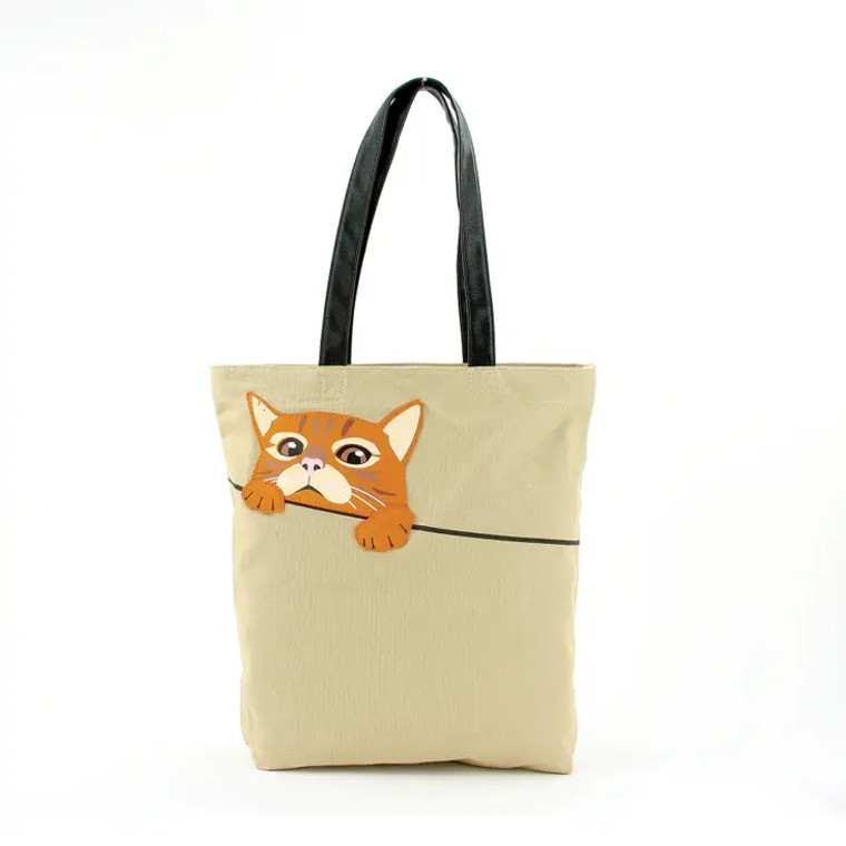 Tan tote, black handles with a peeking tabby cat.