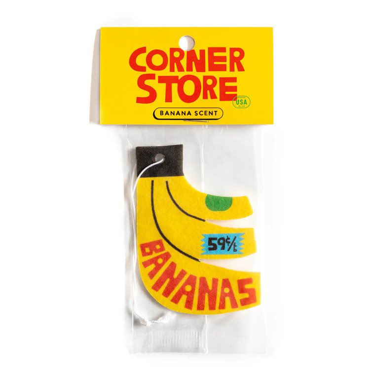 Yellow banana shaped air freshener inside it's packaging.