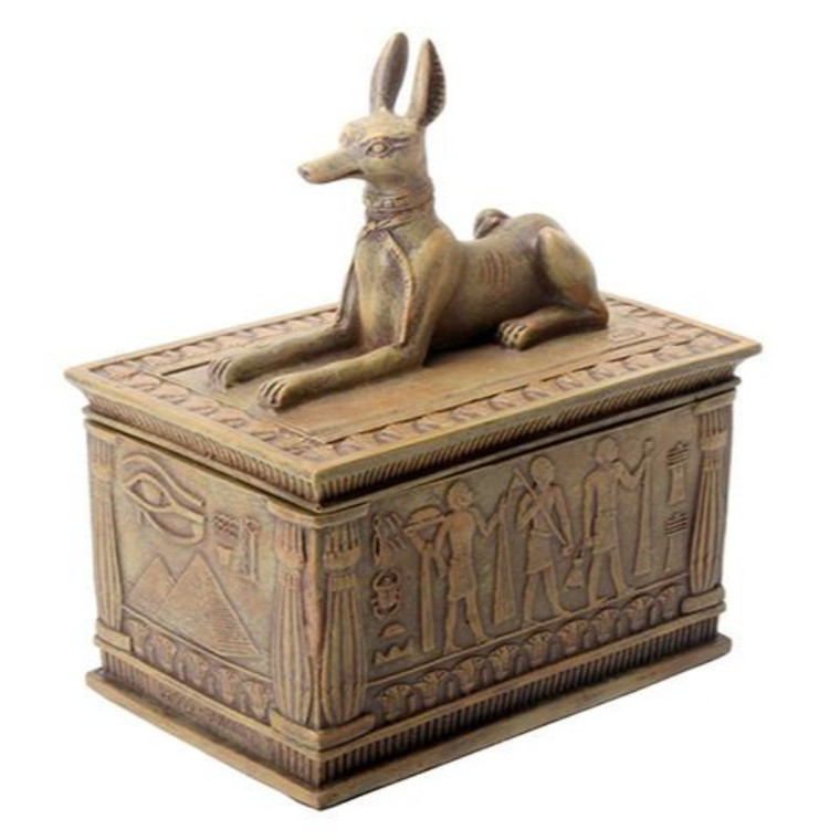 a small sandstone colored trinket box with an anubis on the lid and various heiroglyphics on the sides