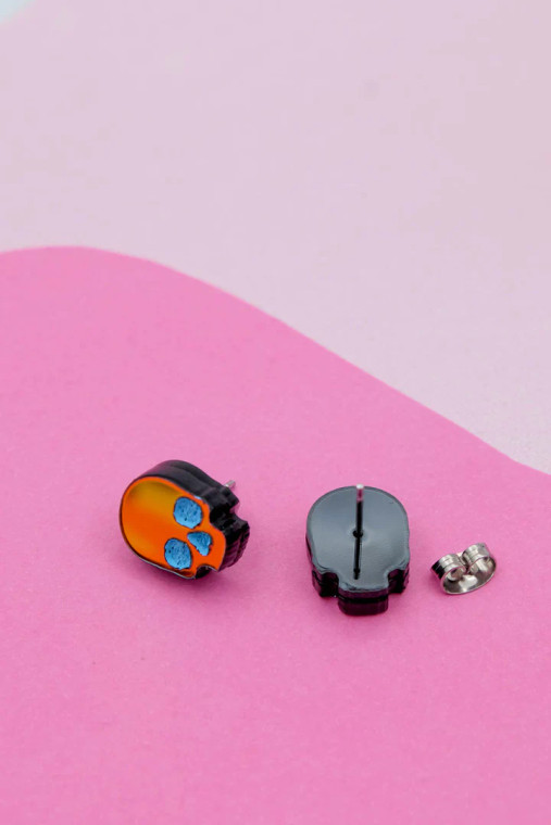 Iridescent skull stud earrings, front and back.