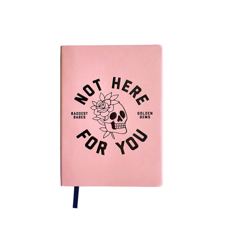 Pink notebook, black foil pressed skull and text, "not here for you".