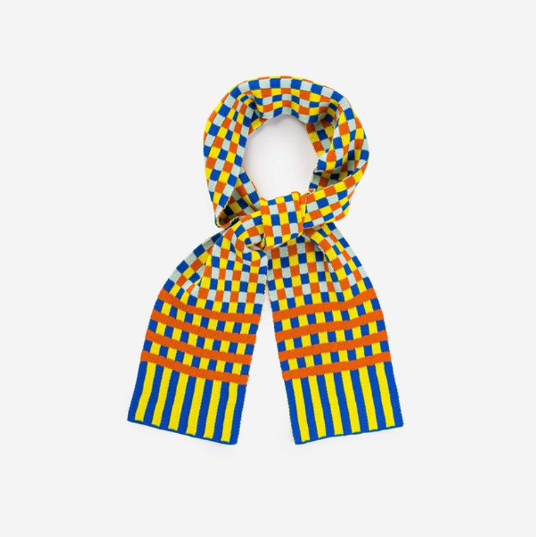 Cobalt, bright yellow, light blue, and pumpkin  jacquard scarf tied in knot.