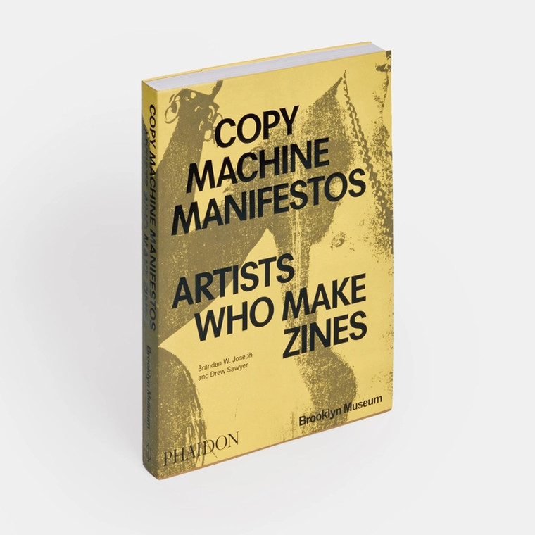 3/4 view, Yellow book cover, text in black: Copy machine manifestos, artists who make zines.